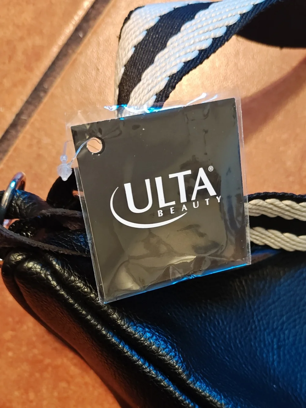 Ulta Beauty Black Leather Crossbody Belt Bag with Black-and-White Striped Strap